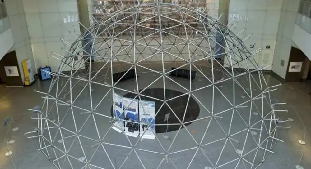 The aluminum frame reassembled in a museum hall